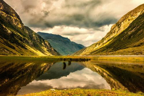 a view of a river between two mountains at Relax & Vitalhotel Adler in Schruns-Tschagguns