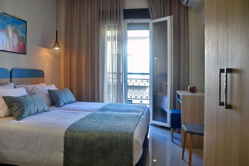 Postel nebo postele na pokoji v ubytování City Pearl Dntwn Apts
