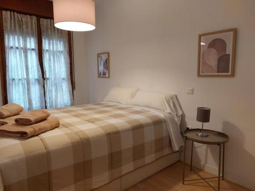 מיטה או מיטות בחדר ב-18 Torres San Miguel