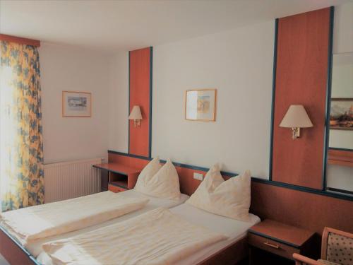 Llit o llits en una habitació de Gasthof Lauber