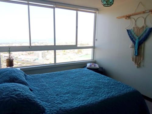 Giường trong phòng chung tại Departamento Coquimbo La Serena