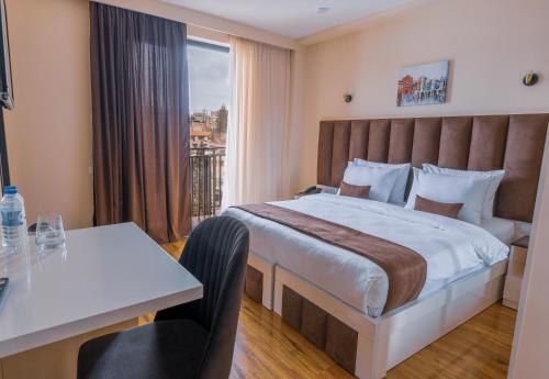 Postel nebo postele na pokoji v ubytování Hotel Residence Plaza