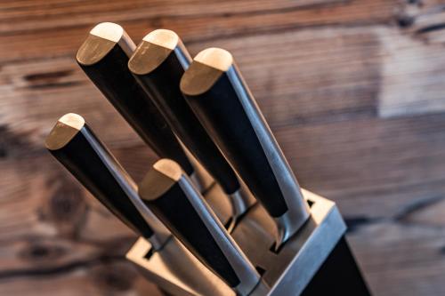 a group of knives lined up in a holder at Gästehaus Wiesengrund & Apart Sporer in Mayrhofen