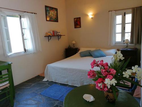 A bed or beds in a room at Katzilieris Country House