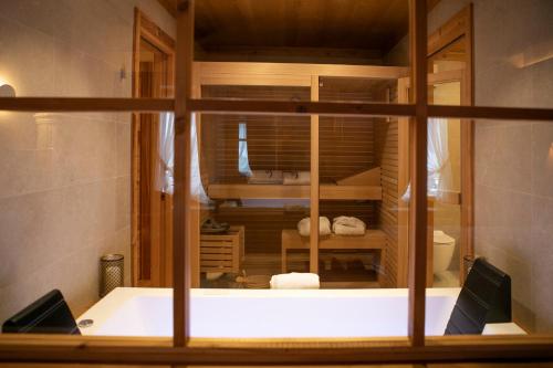 a view of a bathroom through a glass window at Al Capriolo in Vodo Cadore