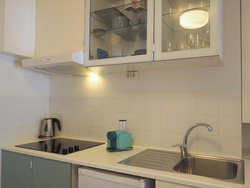 a kitchen with a sink and a counter top at Bela Vista - Lissabon Altstadt in Lisbon