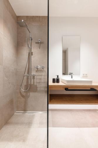 a bathroom with a shower and a sink at Max Mountain Apartments in Neustift im Stubaital