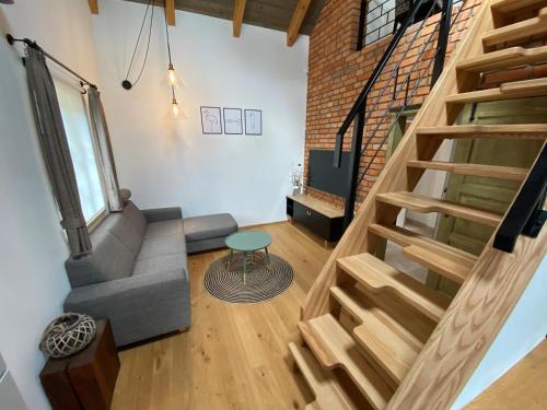 an overhead view of a living room with stairs at Penzion Stodola in Weisswasser in Böhmen