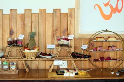 a display of different types of food on shelves at Yog Niketan By Sanskriti in Rishīkesh