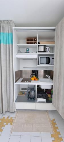 Kuchyň nebo kuchyňský kout v ubytování Superbe Studio Laya vue mer