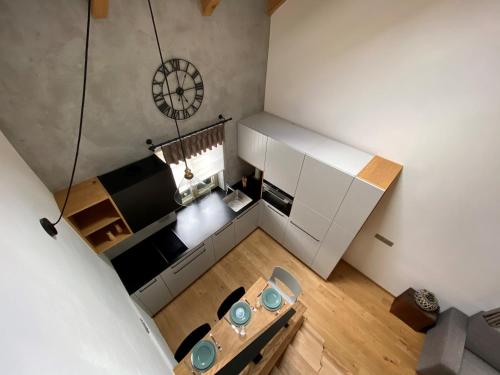 an overhead view of a living room with a table and chairs at Penzion Stodola in Weisswasser in Böhmen