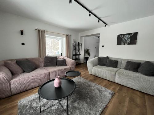 a living room with a couch and a table at Dablin 9 in Korbielów