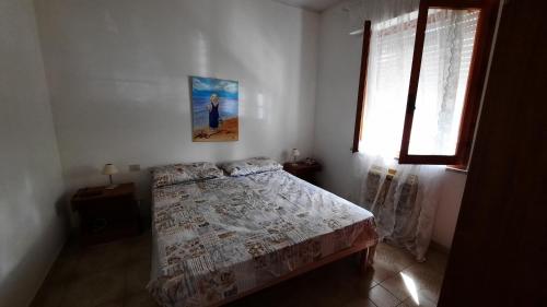Postel nebo postele na pokoji v ubytování A casa di Laura