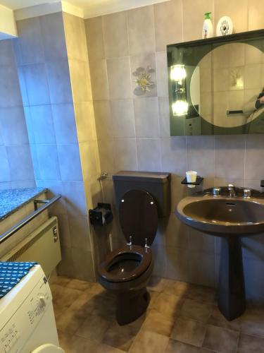 a bathroom with a toilet and a sink at La Casa del Don CIR 0033 in Saint-Rhémy-en-bosses