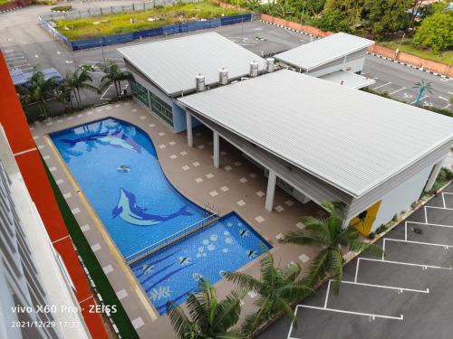 an overhead view of a building with a swimming pool at PavilionVillie Ipoh in Kampong Sengat