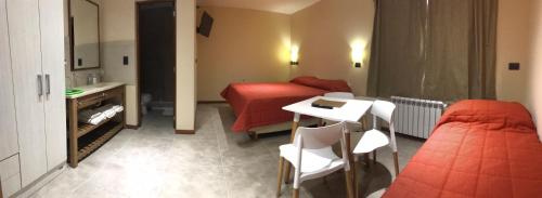 Postel nebo postele na pokoji v ubytování Complejo hotelero Illihue - Cabañas & Hostería