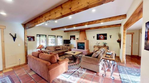 a living room with couches and a table at Arena Roja #2279 in Moab