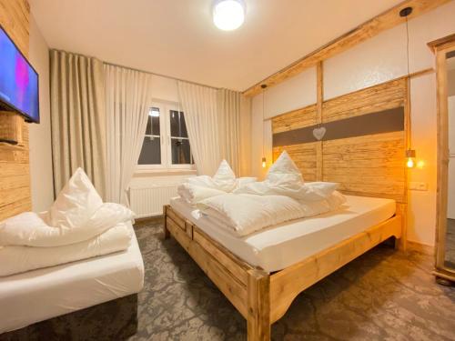 מיטה או מיטות בחדר ב-FEWO Jäger