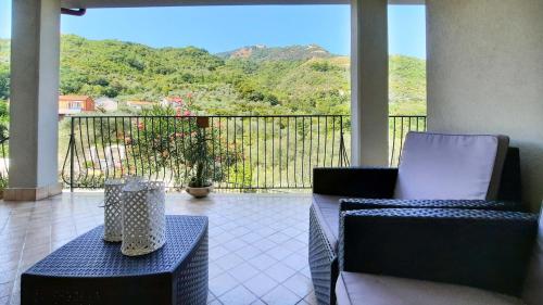 a balcony with two chairs and a table with a view at Casa Elisabetta ShortLets in Caposele