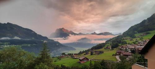 a small village in a valley with a mountain at Large Apartment 8beds great for family and friends, Mountain View in Amden