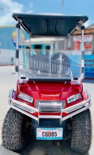 a close up of the back of a red jeep at Hotel Coastalbay 2 & Golf Cart Rental in San Pedro