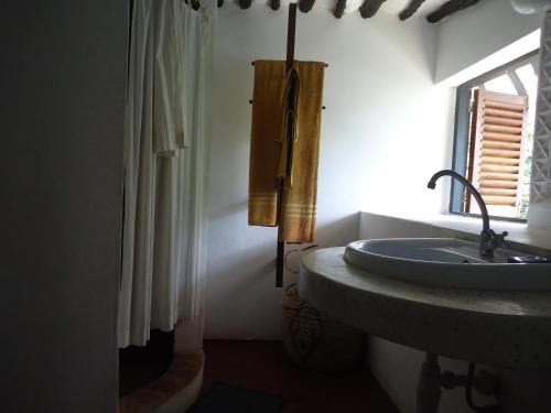 Ванная комната в Kusini Beach Cottages