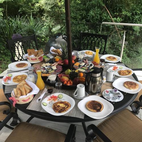 a table full of breakfast food on a table at La Romantica in Contadora