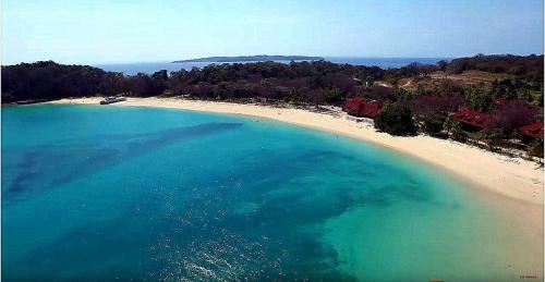 an aerial view of a beach with blue water at La Romantica in Contadora