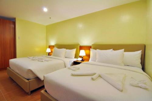 Ένα ή περισσότερα κρεβάτια σε δωμάτιο στο The Well Hotel