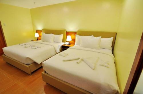 Ένα ή περισσότερα κρεβάτια σε δωμάτιο στο The Well Hotel