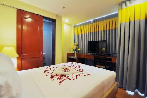 Ένα ή περισσότερα κρεβάτια σε δωμάτιο στο The Well Hotel