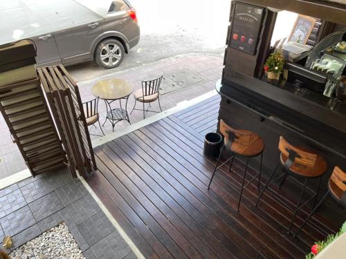 an overhead view of a patio with chairs and a table at Rich Lanna House in Chiang Mai