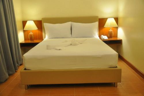 Ένα ή περισσότερα κρεβάτια σε δωμάτιο στο The Well Hotel