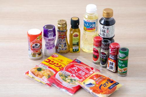 a table topped with different types of food and condiments at B:CONTE Asakusa in Tokyo