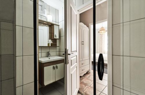 a bathroom with a sink and a mirror at Cicerone Apart in Antalya