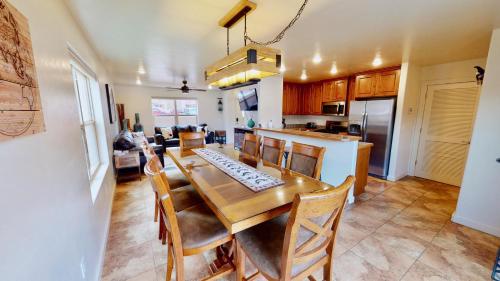 a kitchen and dining room with a table and chairs at Wildhorse Canyon #14A3 in Moab