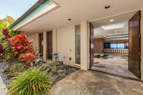 an internal view of a house with a garden at Waterfall House - Hawaii in Kailua-Kona