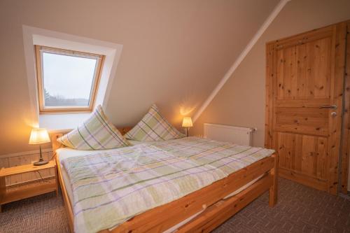 Una cama o camas en una habitación de Ferienwohnung Schmidt in Altglobsow