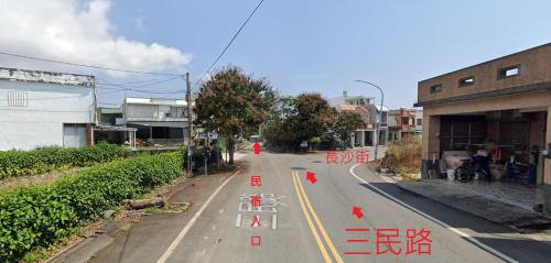 an empty street with red writing on the road at Taitung Crabs House in Chenggong