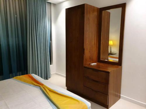 Ένα ή περισσότερα κρεβάτια σε δωμάτιο στο Hasara Oceanfront Apartments