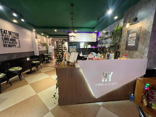 a bar in a restaurant with a counter in the middle at HY Local Budget Hotel - 5 mins walk to Hoi An Ancient Town in Hoi An