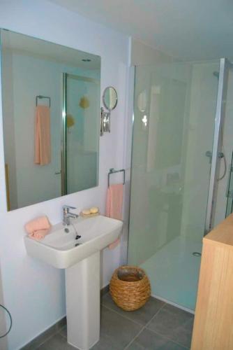 a bathroom with a sink and a shower at Chic Home with garage Almuñecar San Cristobal in Almuñécar
