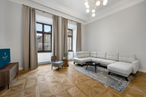 a living room with a couch and a table at Palace Apartments in Bratislava
