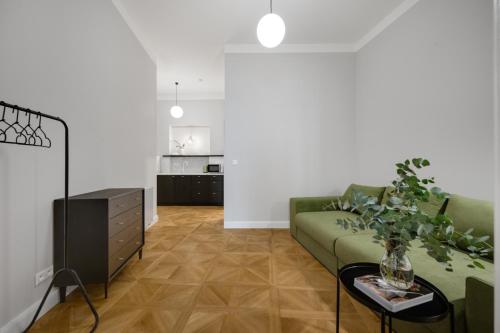 a living room with a couch and a table at Palace Apartments in Bratislava