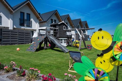 a yard with a playground with a play equipment at Chłapowska Przystań in Władysławowo