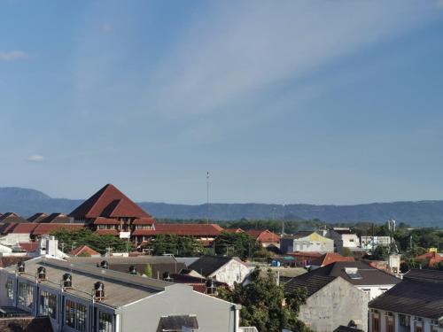 a view of a city with houses and buildings at A Peaceful Room at Barsacity Apartment by Ciputra in Seturan