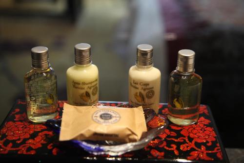 a group of four bottles of alcohol on a table at Garden Hotel Suzhou in Suzhou