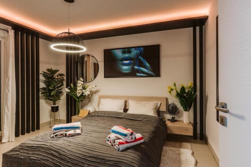 a bedroom with a bed with two pillows on it at Monaco view, pool, garage, 100 m2 terrace in Beausoleil