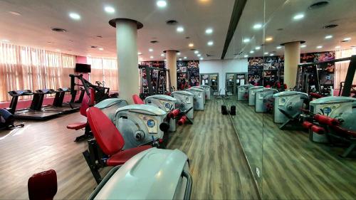a gym with a bunch of machines in it at Jewel Sport City and Aqua Park in Cairo