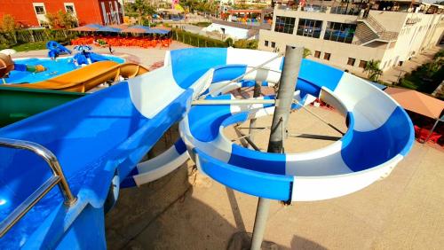 a blue and white water slide at a water park at Jewel Sport City and Aqua Park in Cairo